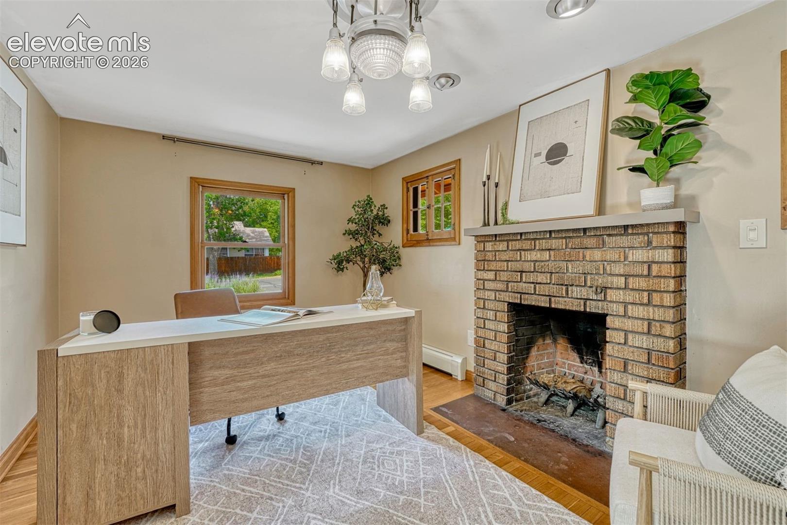 The stone fireplace is the feature of this room that can be used as a bedroom, dining room, living room or office