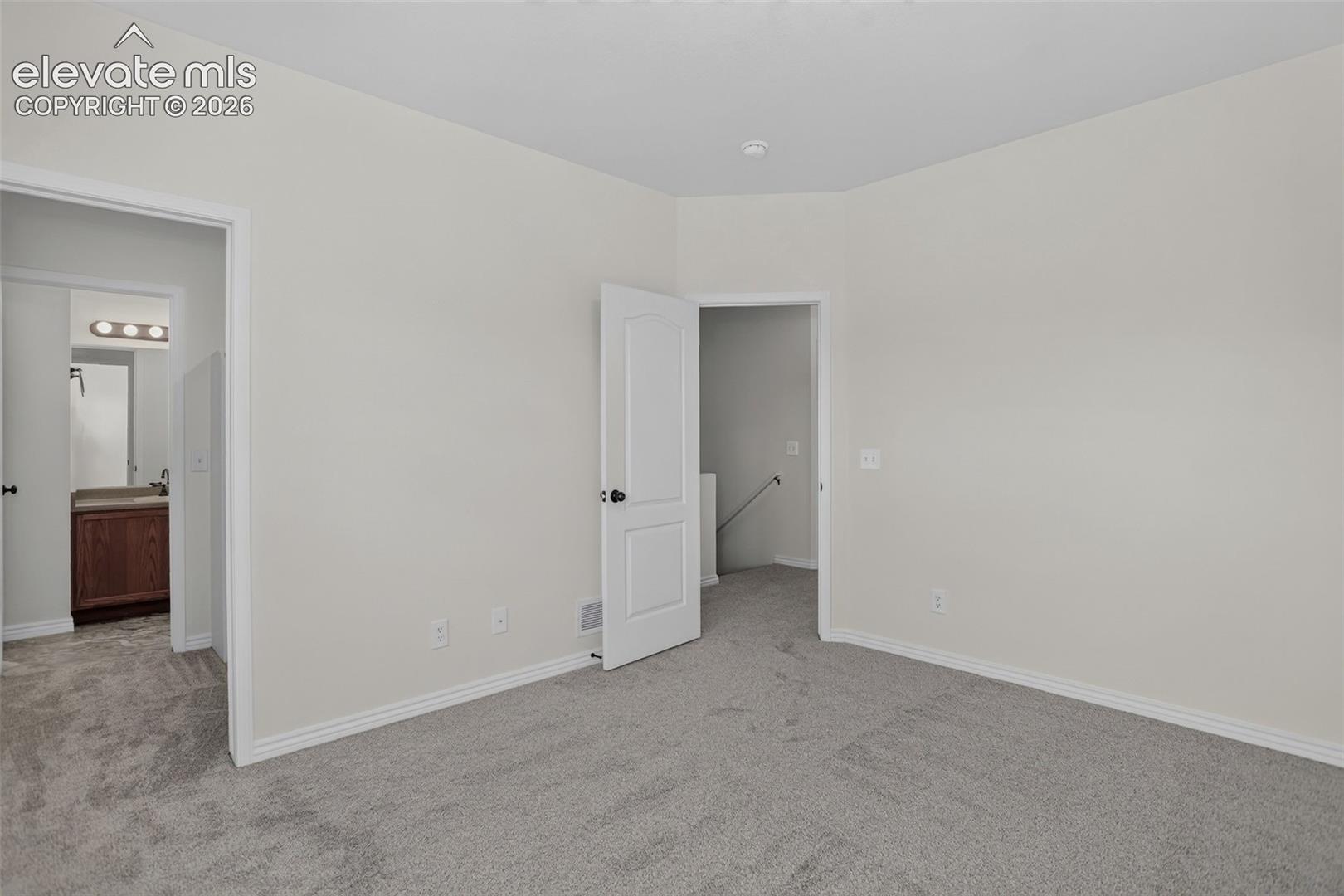 Ensuite bath and walk-in closet from Bedroom