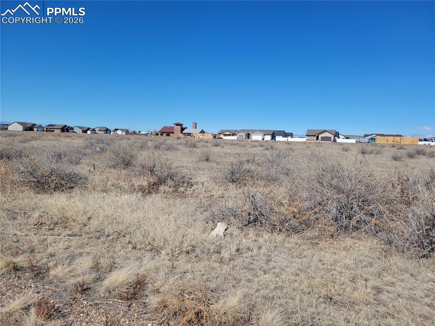 Commercially zoned lot north of Hwy 50 with easy access to I-25 Colorado Springs & Pueblo.  Flat & easy to build with mountain views.  Water main runs down the street. Lot is 250' long with 50' frontage.