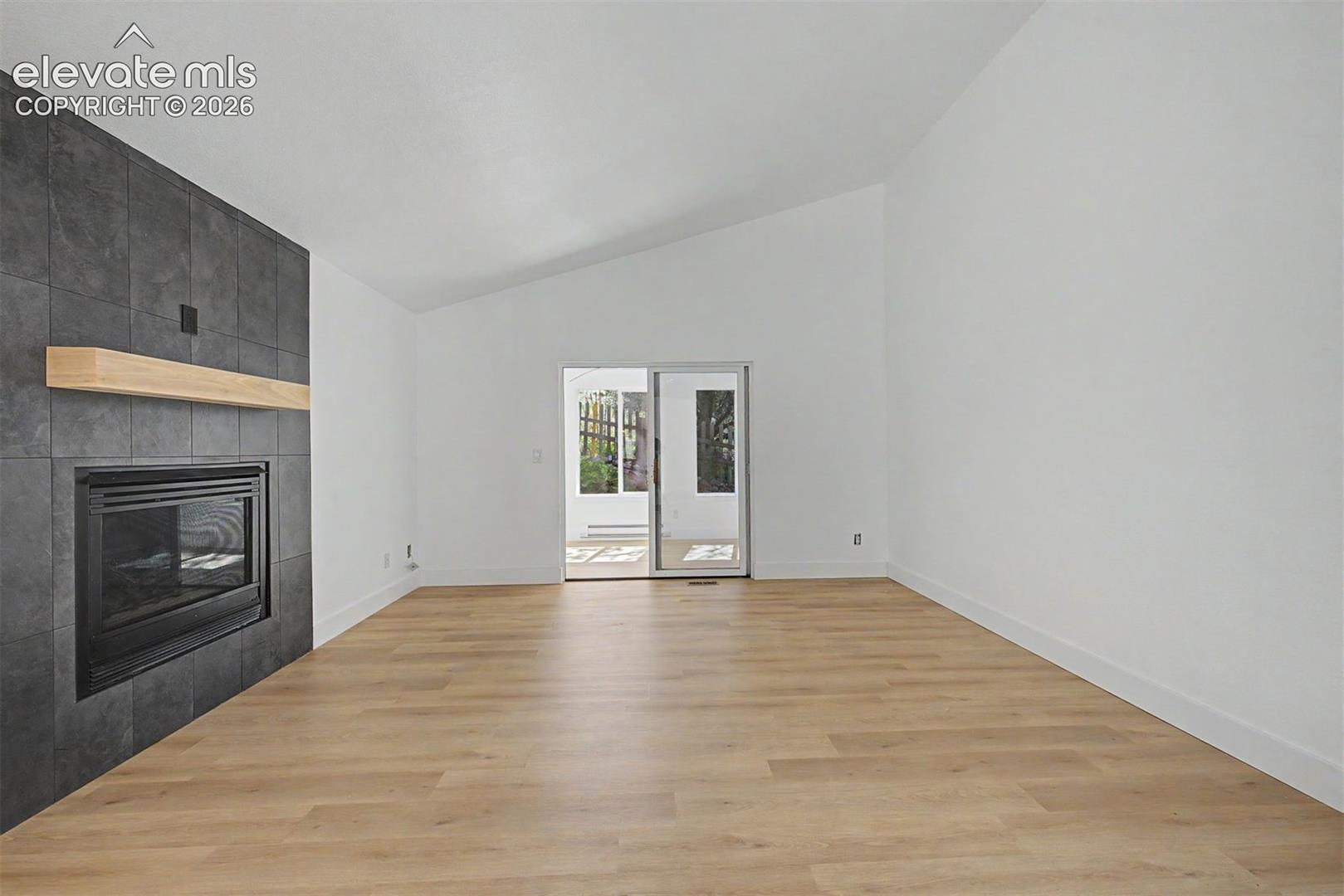 Living room with fireplace and attached sunroom