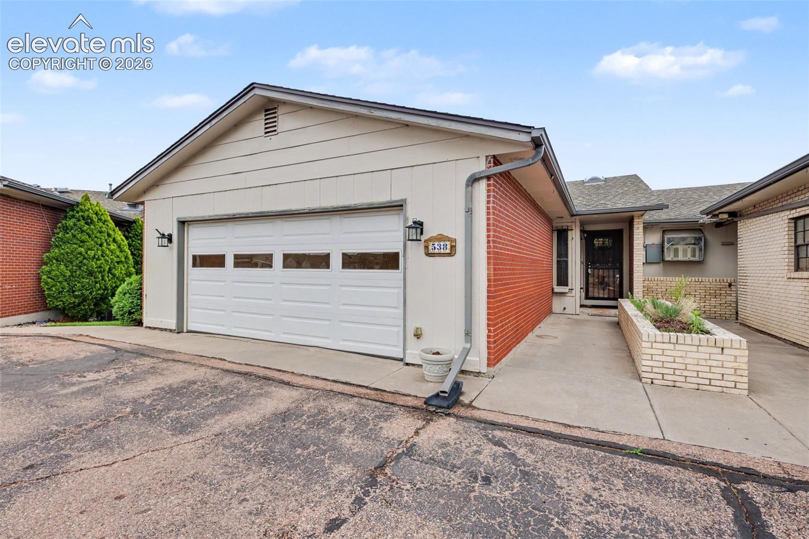 Recent improvements, including new carpet throughout the home!!!  Thank you for your interest in this lovely townhome.  It is centrally located in a quiet covenant protected community, lots of conveniences nearby. This home features a large eat-in kitchen with nice matching appliances and oak cabinets.  Then there is a fabulous spacious main level living area with a gas fireplace surrounded by builtin bookcases. Walk out onto the large covered composite deck for views of Pikes Peak, lush open greenspace and just beyond is Valley Hi Golf Course, very serene and peaceful.  Also included on the main level is the master suite and a secondary bedroom and full bath.  The full basement is where you will find one other large living area, with wet bar and graced with another cozy fireplace, walkout to the large concrete patio.  This basement level boasts one other bedroom, a full bath and plenty of space in the storage room.  Truly is move-in ready, professionally cleaned.