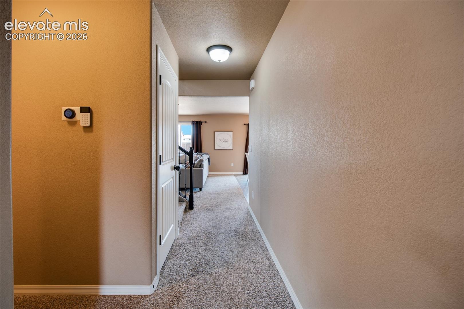 Hallway into the Family Room, Dining Area, and Kitchen.