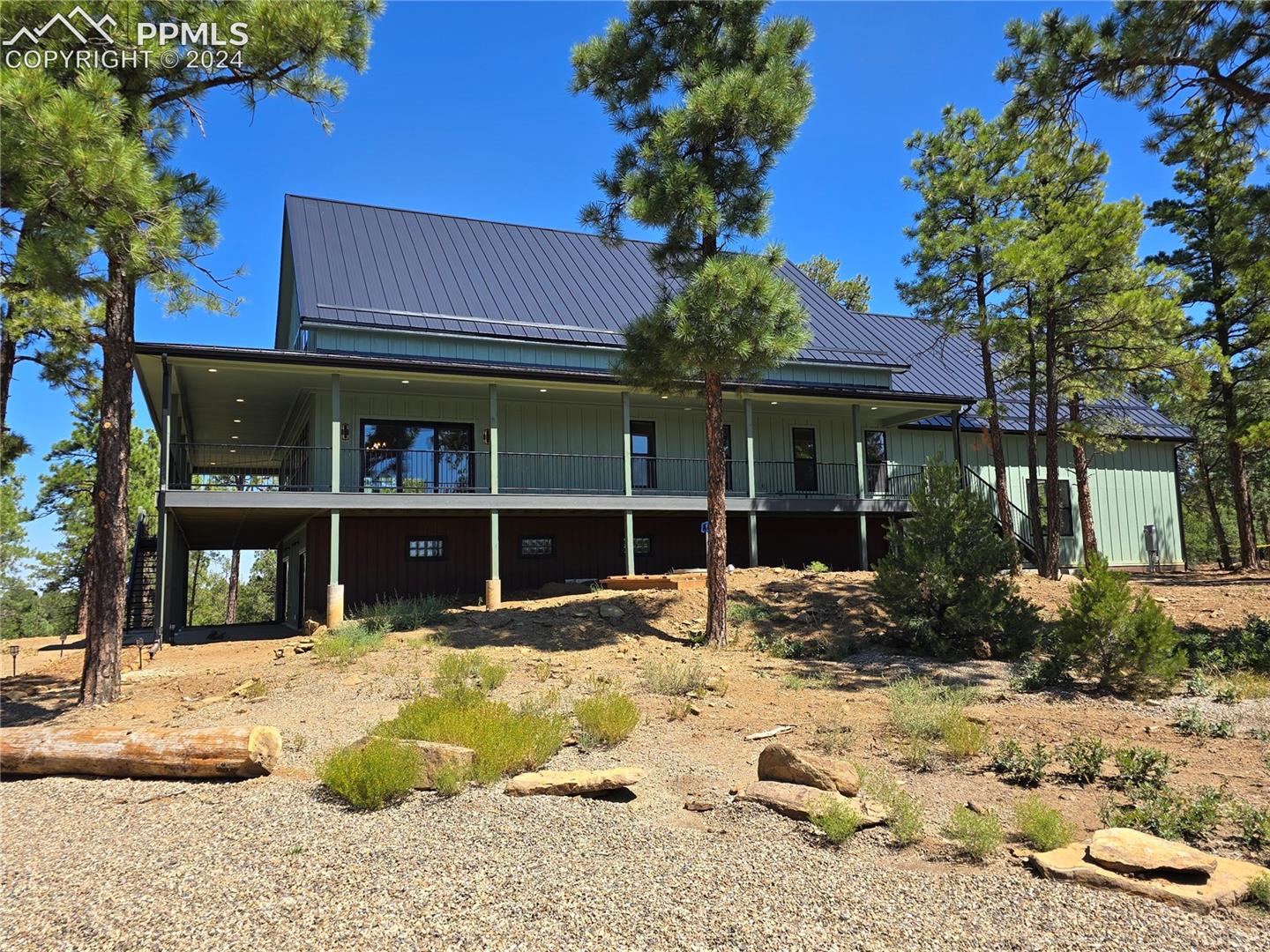 Side view of property featuring a balcony