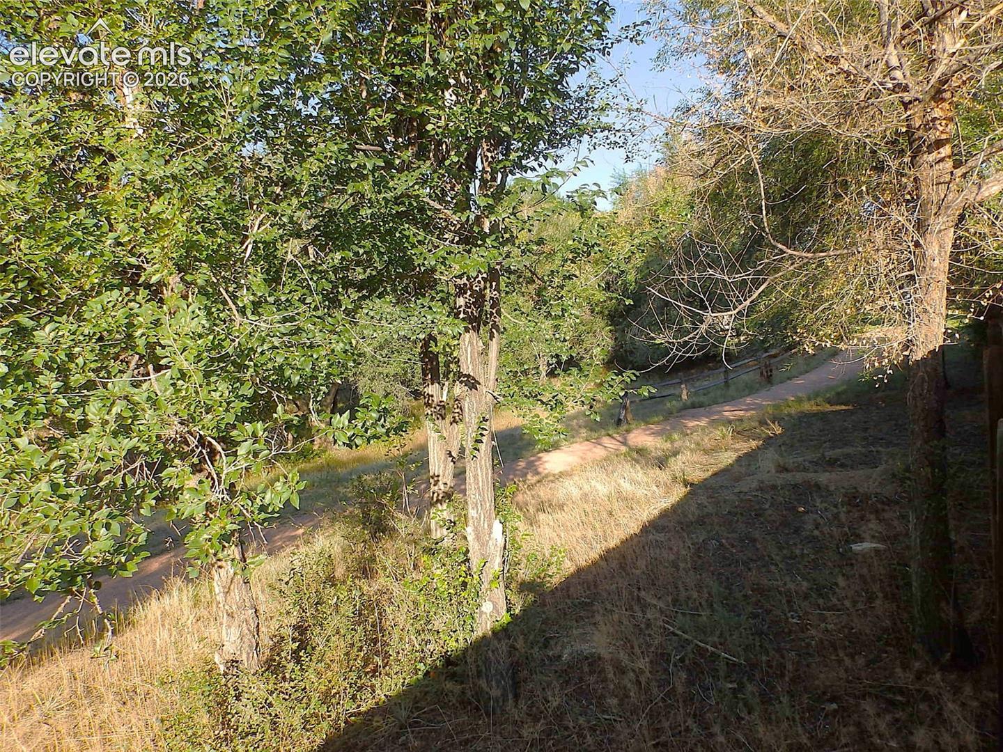 walking trail behind the fence