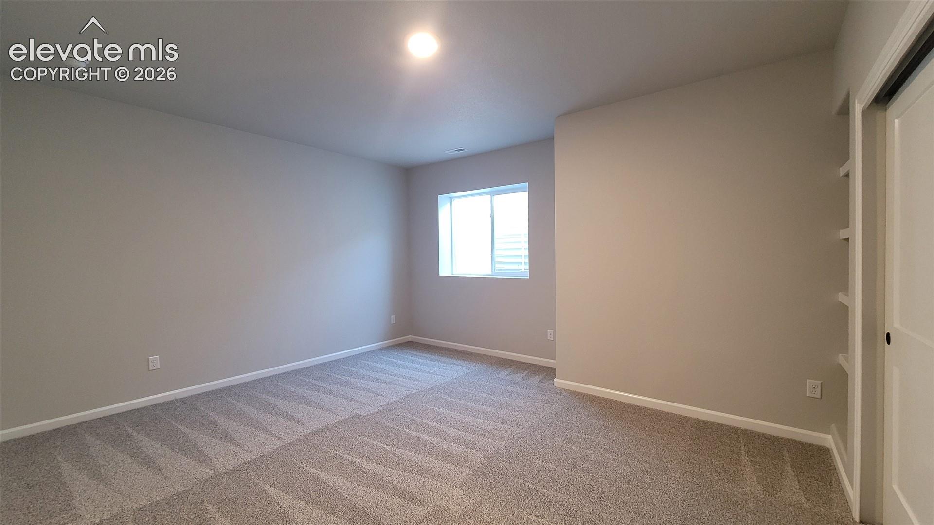 3rd Bedroom, with built-in shelving, located in the lower level! 