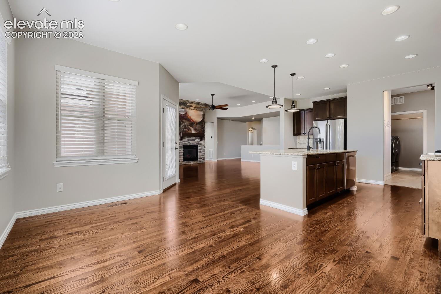 Beautiful dining room with spacious design, open concept floor plan, all out to deck and gorgeous wood floors.
