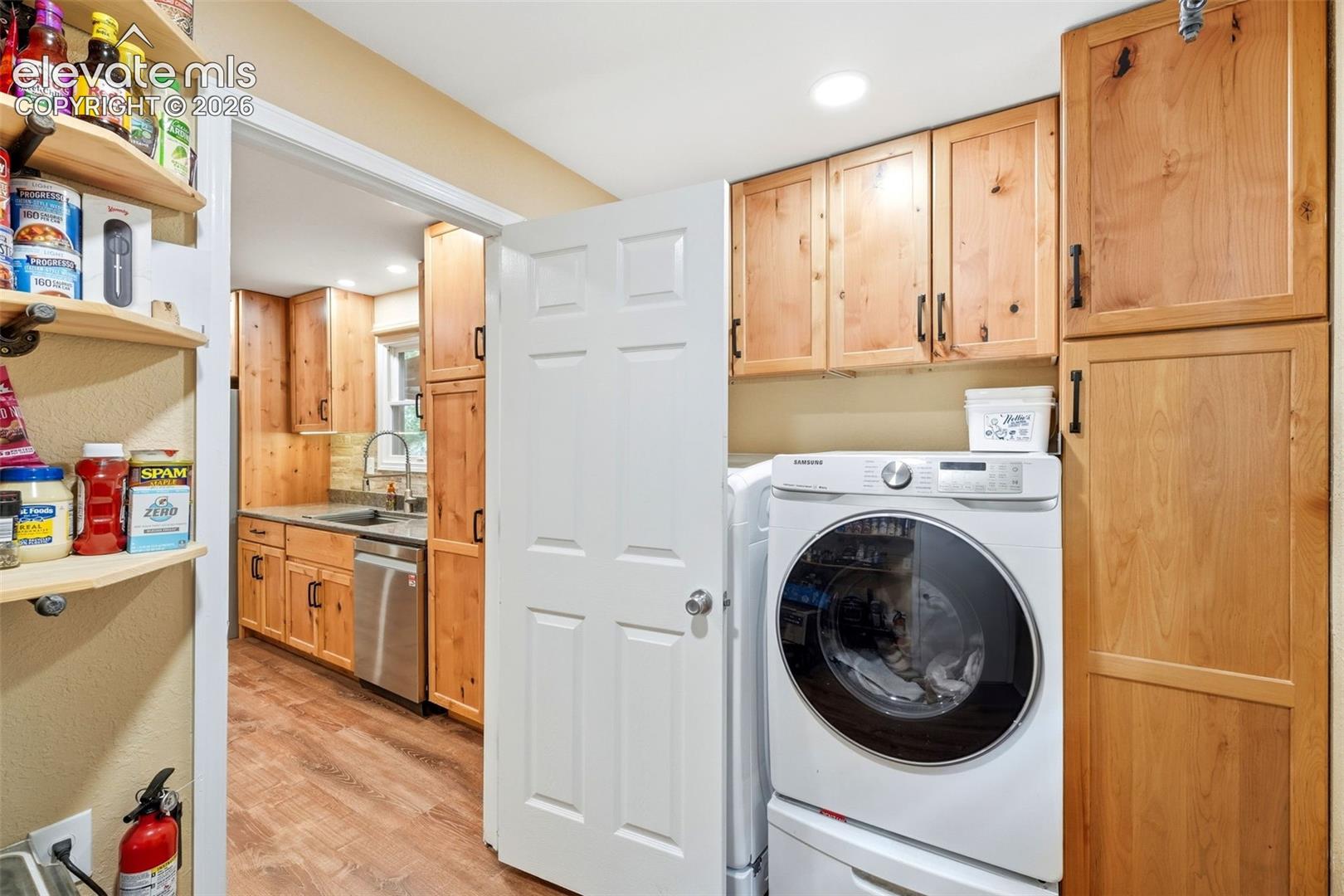 Laundry room off the kitchen with built-ins