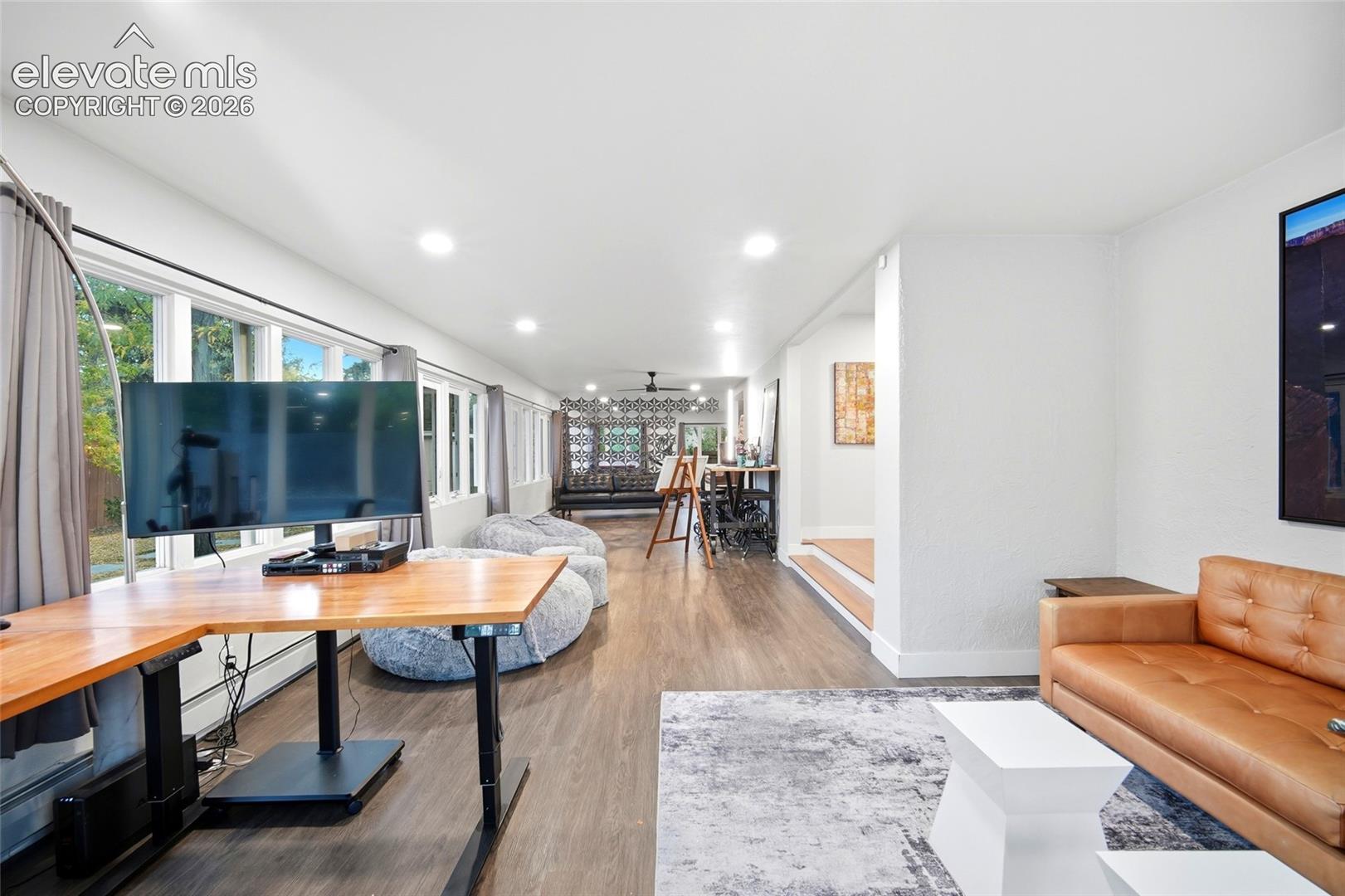 The sun room is adjacent to the dining room, which is just at the top of the two stairs. This floor plan is SO mid-century! 
