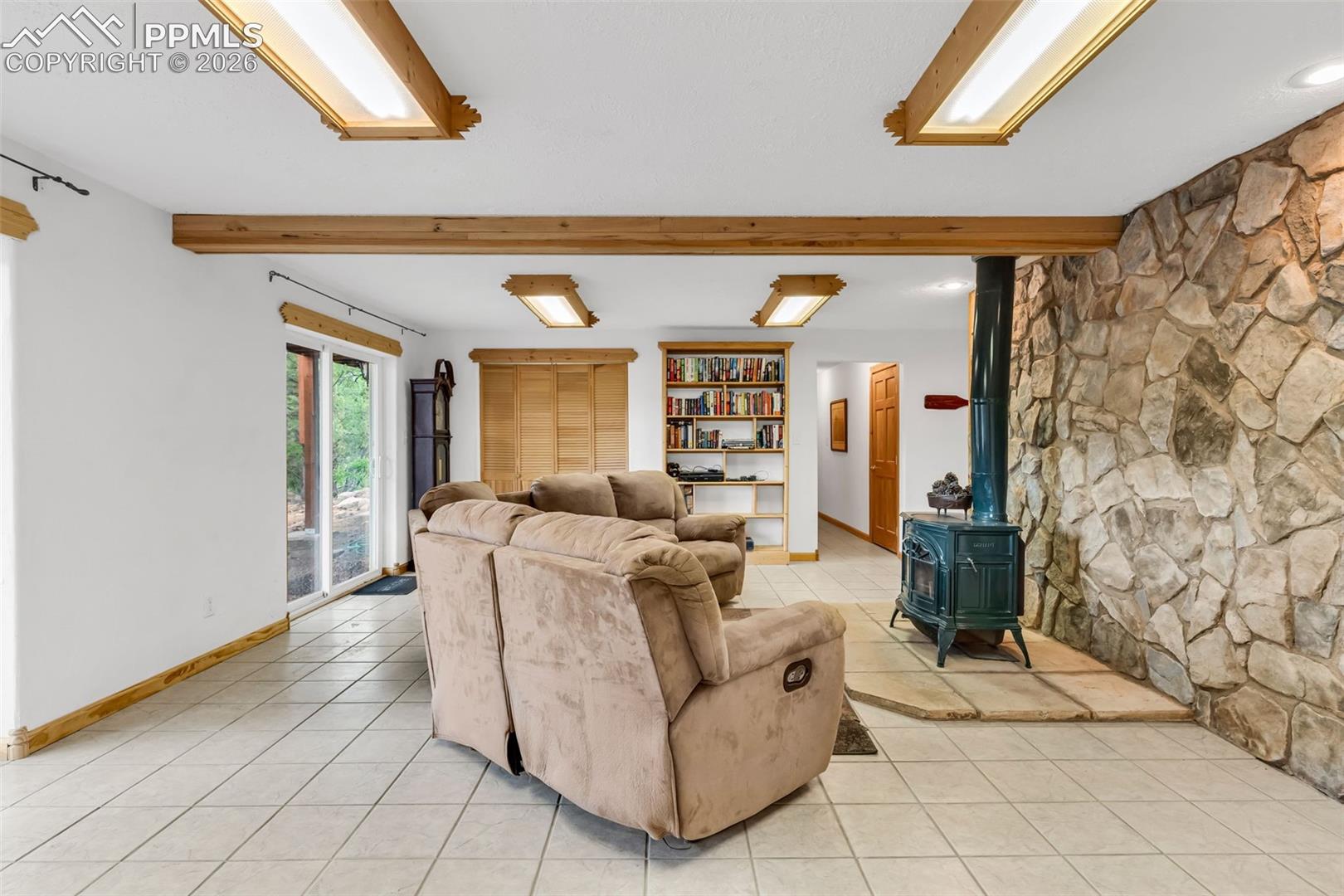 Cozy fireplace and large laundry closet with laundry sink