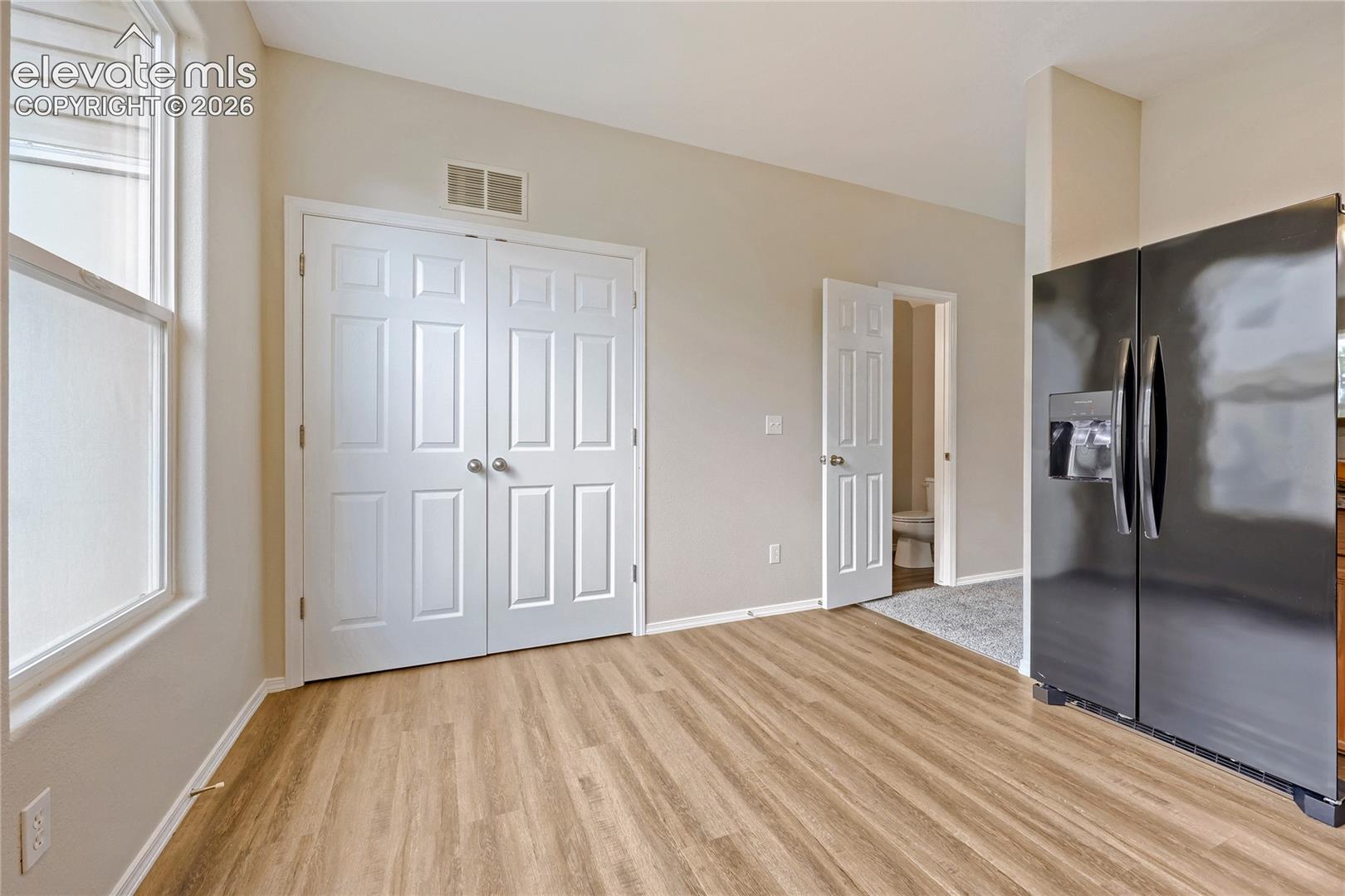 Welcome to this spacious and desirable end-unit townhome in the sought-after Fountain community! Offering 3 bedrooms, 3 bathrooms, and 2 assigned parking spaces, this home combines comfort, functionality, and convenience in an ideal location close to schools, parks, and everyday amenities. Step inside to an open and inviting floorplan with plenty of natural light, freshly updated with new interior paint, new carpet, and new luxury vinyl plank flooring in the entry, kitchen, and bathrooms. The flexible dining space allows you to dine in either the kitchen or main living area, perfect for everyday living or entertaining. The main-level laundry adds convenience and ease. Upstairs, you'll find three generously sized bedrooms, including a spacious primary suite with its own en-suite bath and walk-in closet. Additional upper-level bedrooms offer versatility for family, guests, or home office needs. As an end unit, this home enjoys extra natural light and added privacy compared to interior units. With its fresh updates, prime location, smart layout, and desirable end-unit setting, this townhome is move-in ready and a wonderful opportunity you don't want to miss!