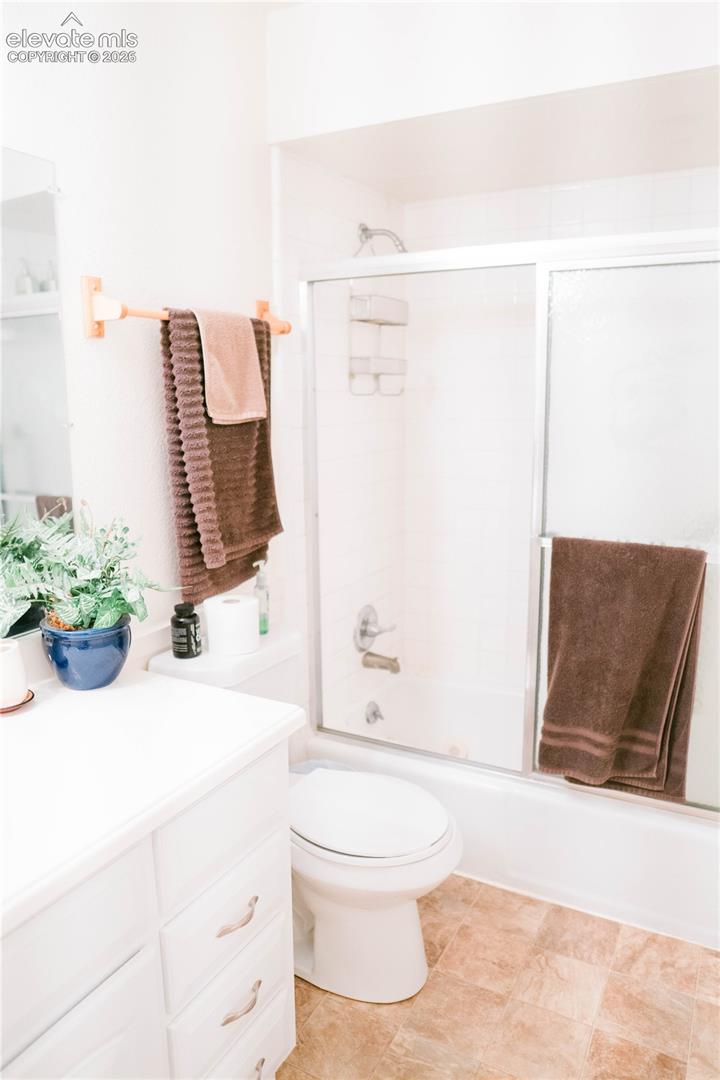 White vanity with cabinet storage and drawer pulls