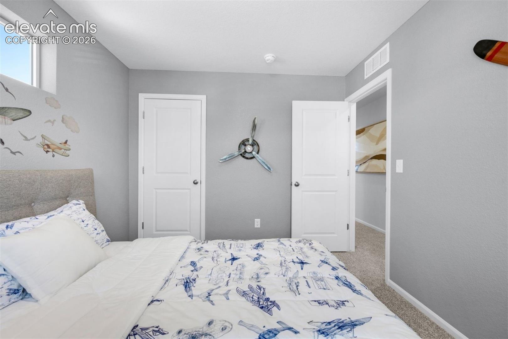 Recessed window providing natural light, two panel interior doors, and neutral wall tones
*photos of a model home*