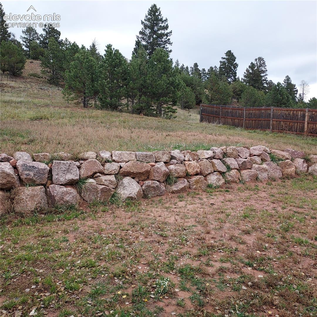 Natural stone retaining rip rap wall.