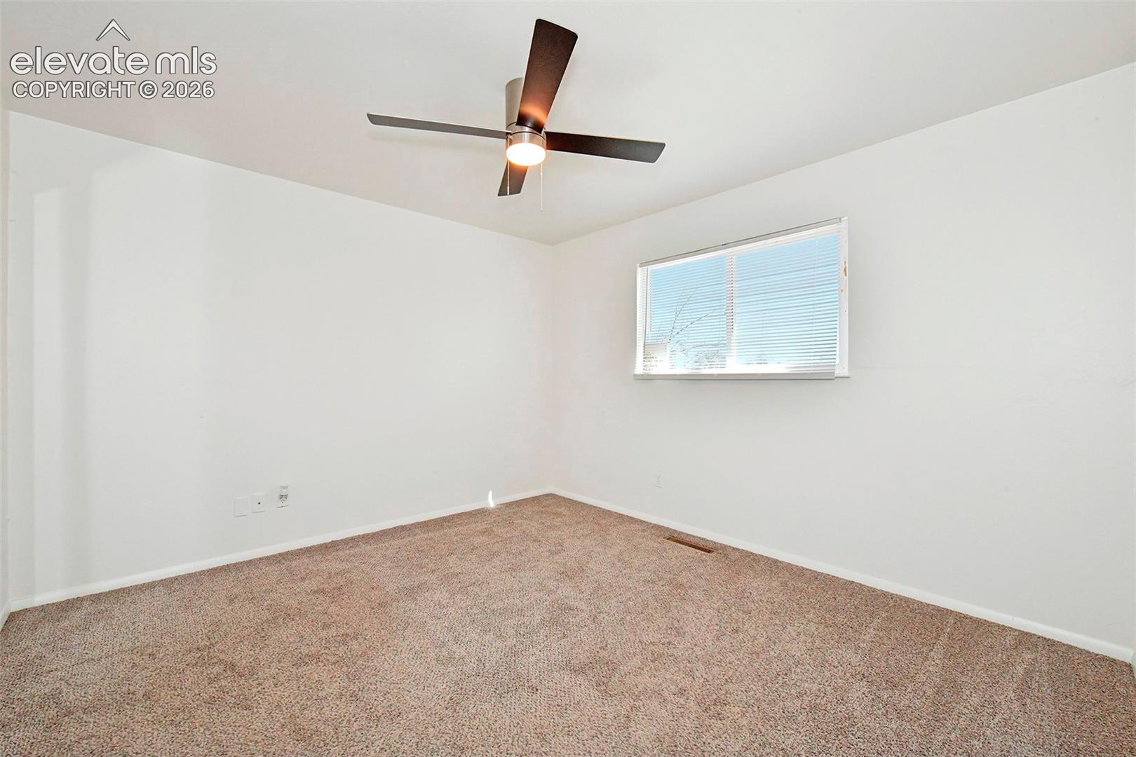 Upper rear facing bedroom with new ceiling fan