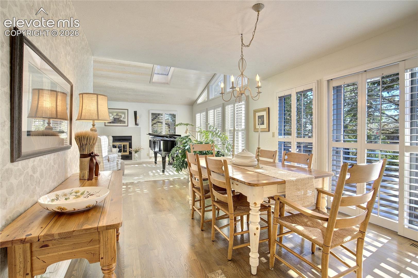 Gleaming hardwoods + abundant natural light create an easy connection between the home's generous gathering spaces.