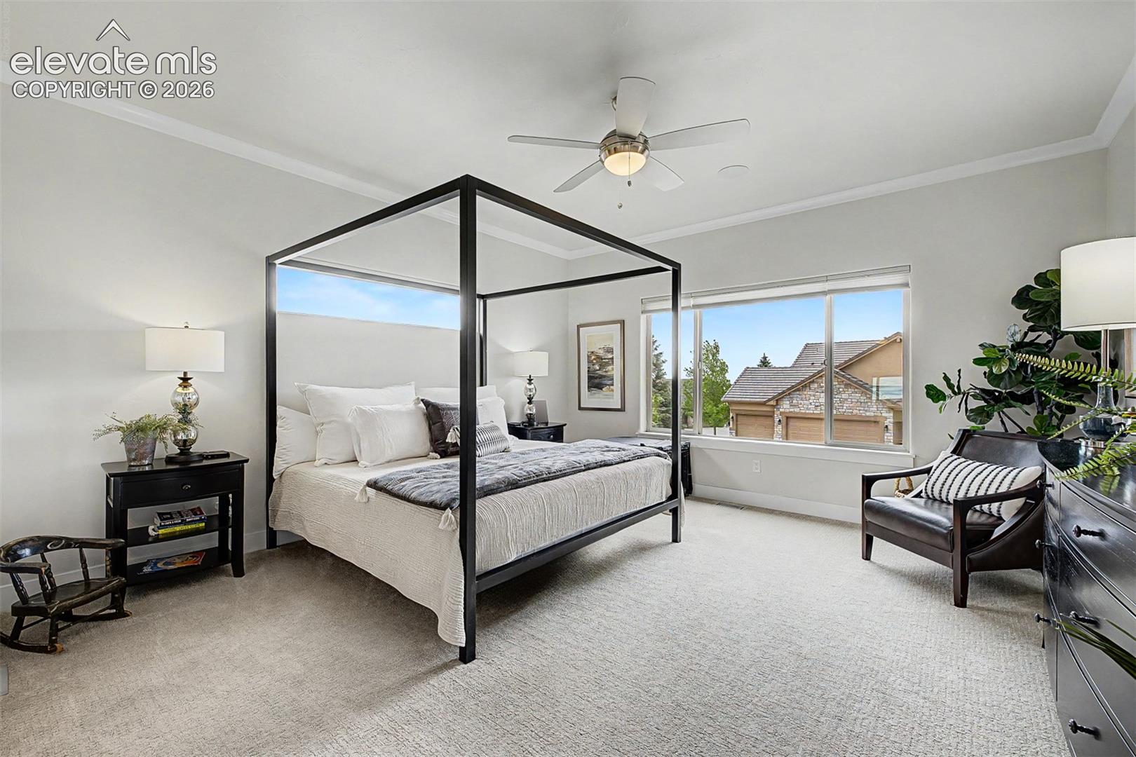 Large spacious primary bedroom with top to bottom custom shades and upgraded carpet!
