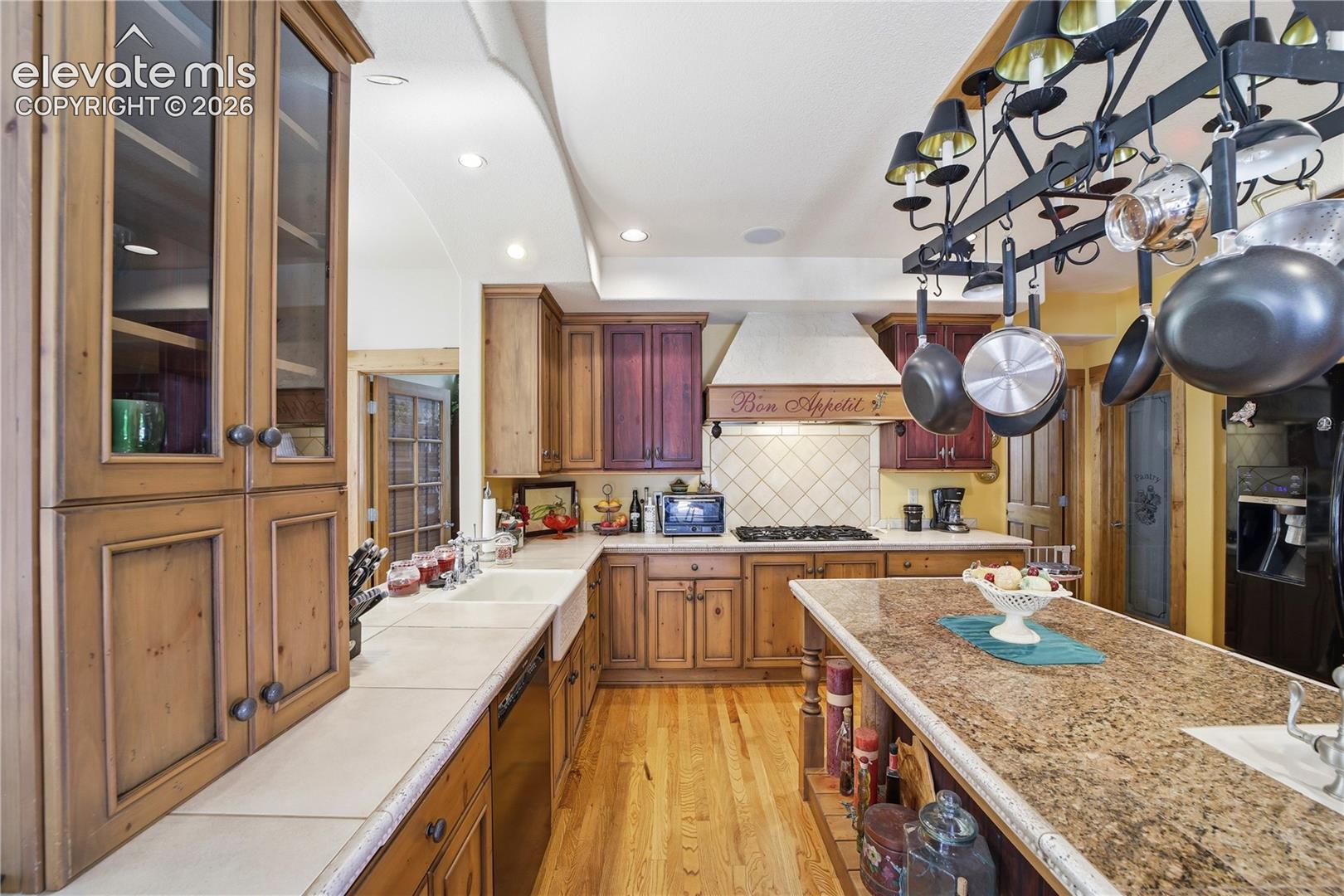 Apron sink, chef sink, 2 ovens and hanging pot rack