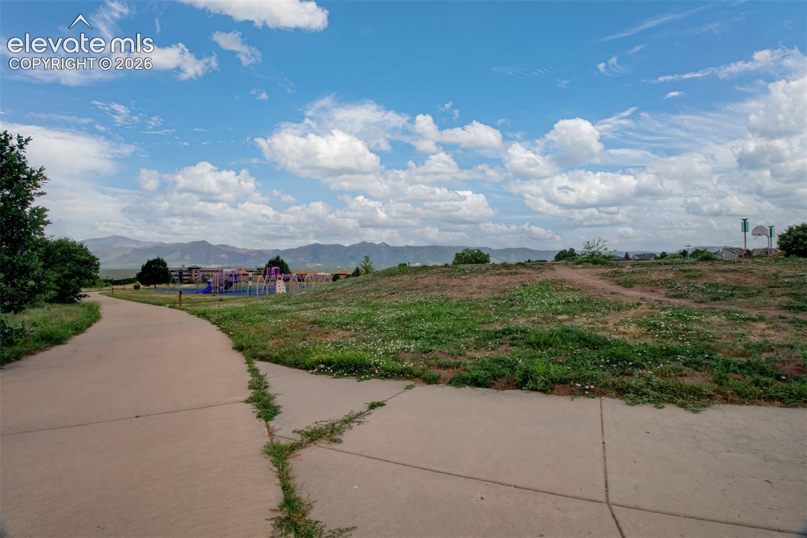 View of mountains and elementary school from trail of open space