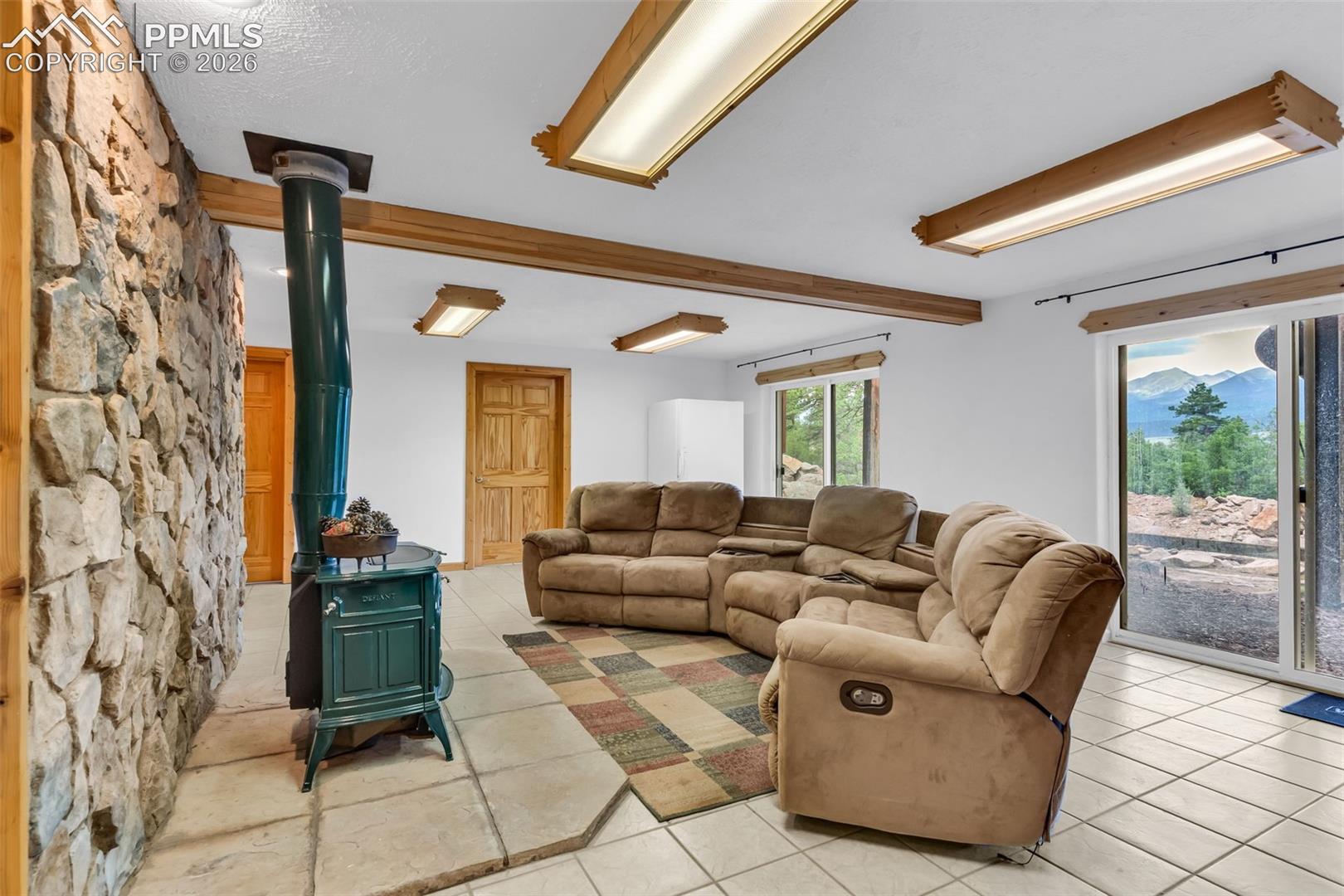 Multiple walkouts from the den to the back yard. Enjoy the mountain views, even from the basement!
