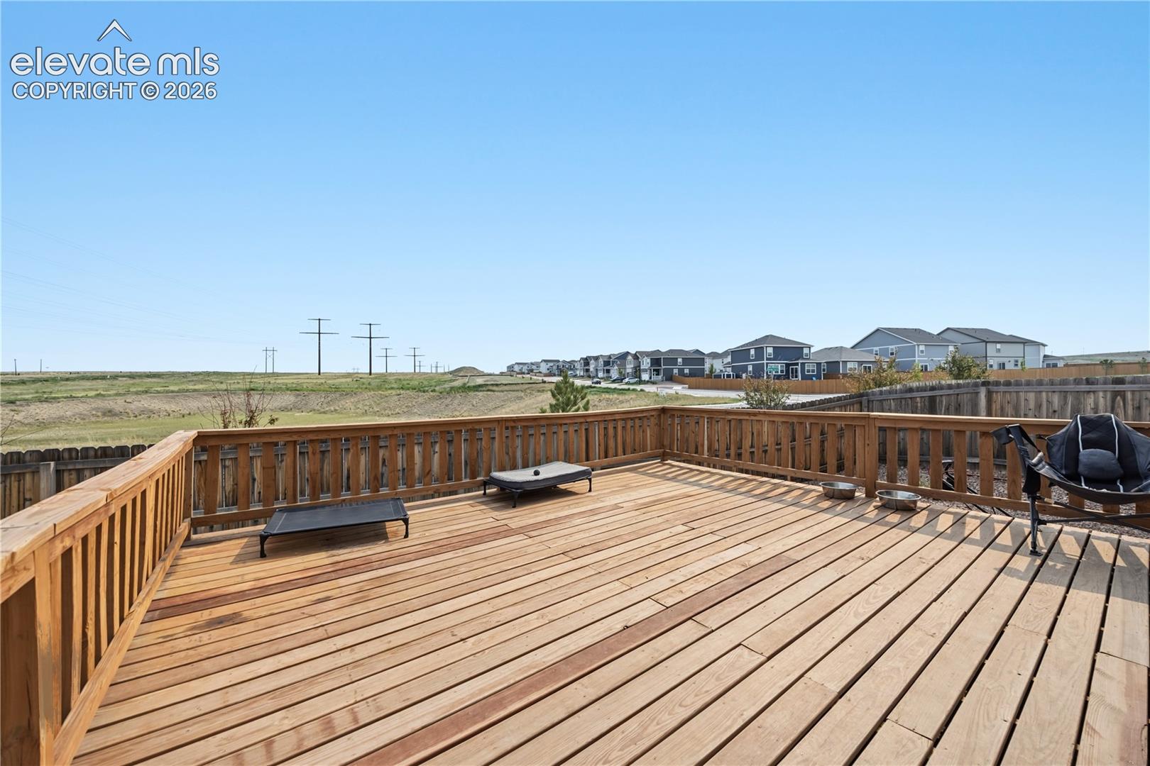 Large backyard deck to enjoy the beautiful Colorado sunshine and great for outdoor dining and entertaining.