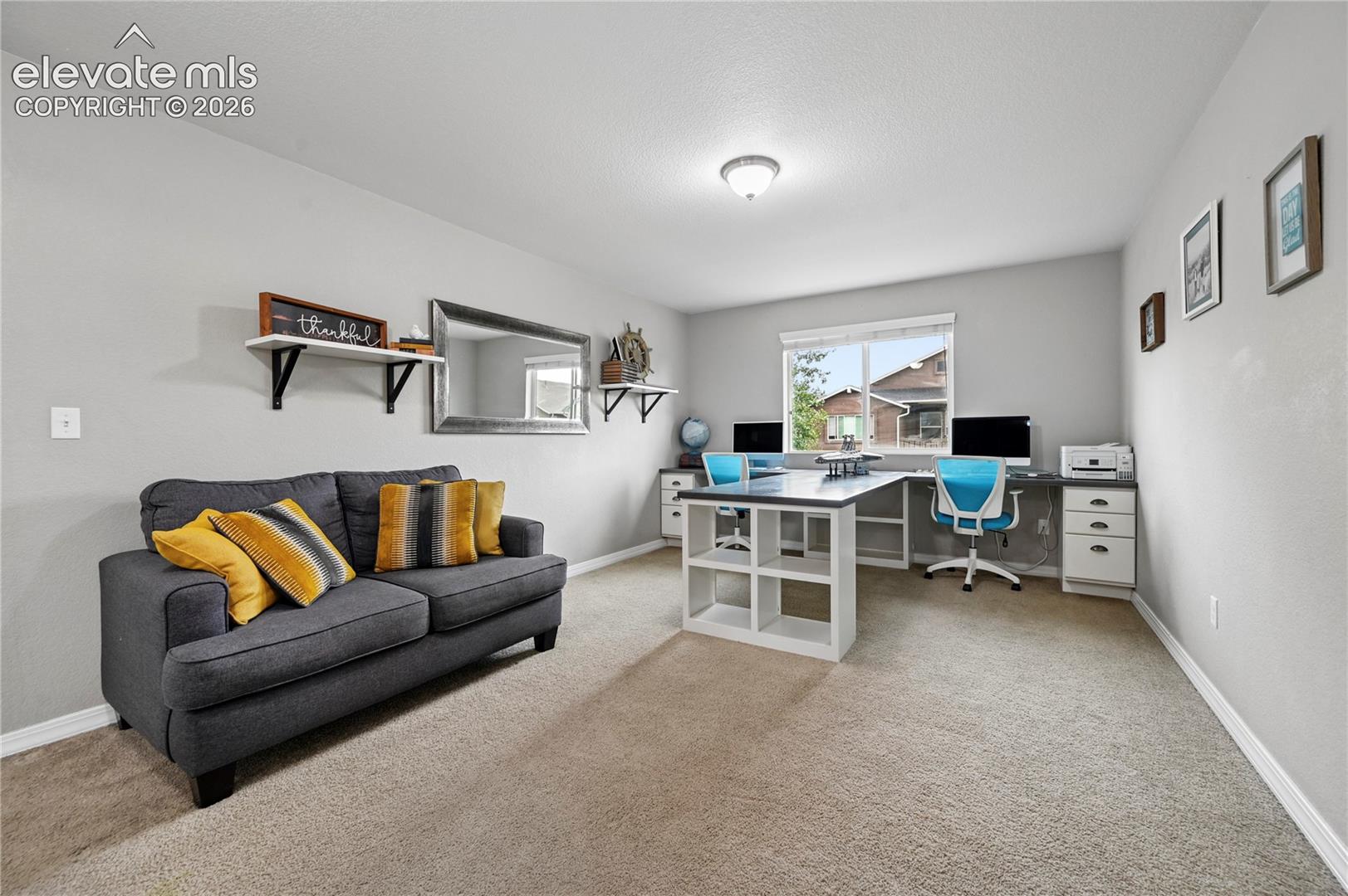 Head upstairs and you'll find the second of four flexible living rooms, with this one used as a loft.  If you have two work-from-home people or multiple students in your household, this included dual desk will come in handy.