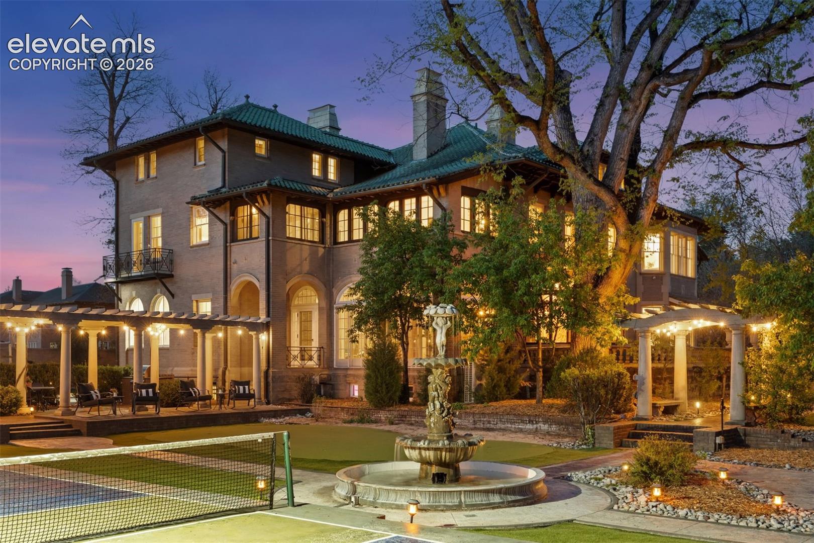 Beautiful estate grounds with fountain, firepit, reflection pool, pickleball court, putting green and multiple large entertainment areas