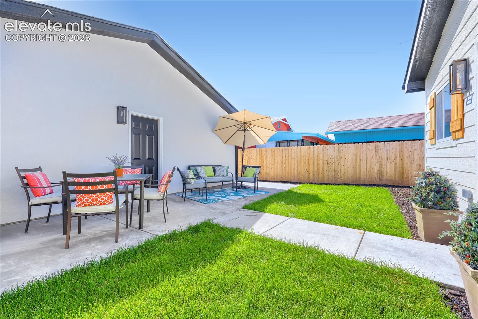 The backyard features a wonderful back patio, with plenty of room for a dining table/chairs, and a lounge area. The lawn has a built-in sprinkler system to keep your lawn in perfect condition!