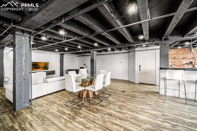 featuring wood finished floors and baseboards