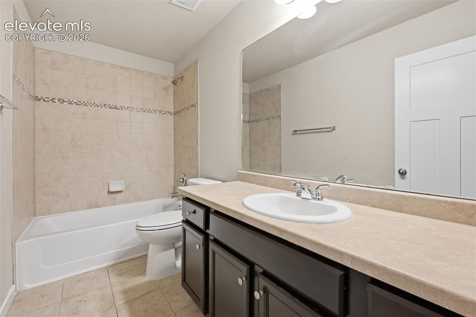 A full lower-level bath makes the finished basement especially functional for guests and extended living.