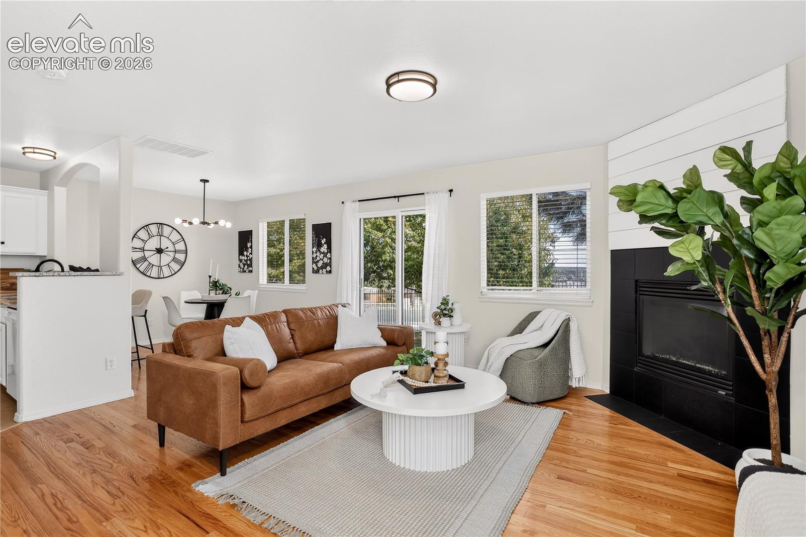 Living room with gas fireplace and walk out to back yard. 