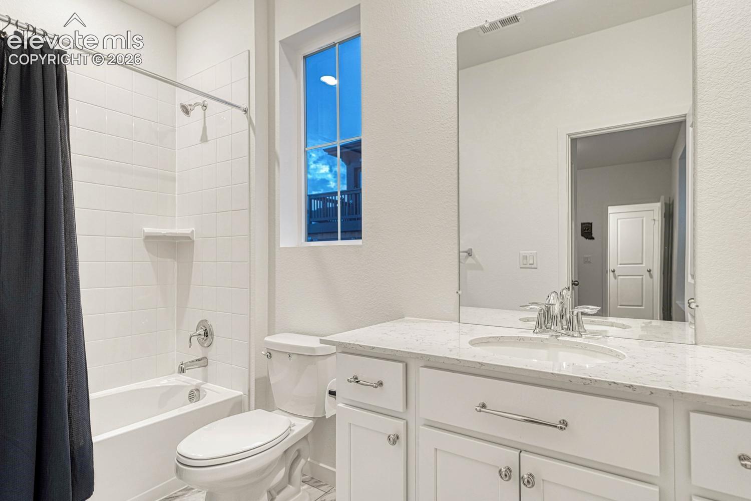 Main level bathroom joins bedroom