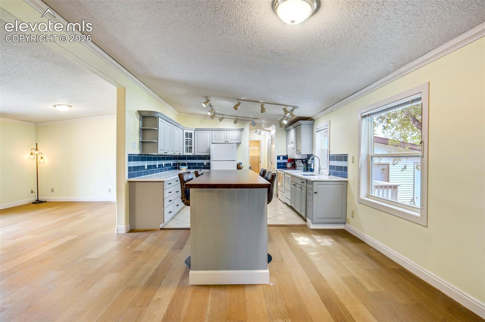 Open layout with oversized island and seating area.