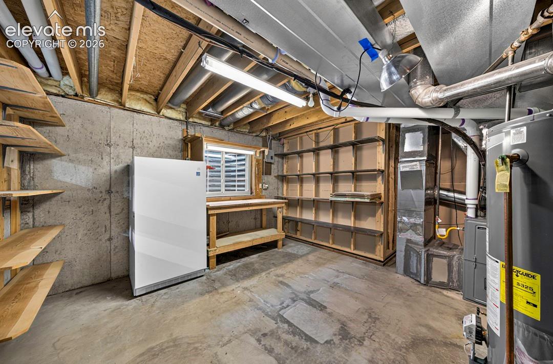 Opt. 2nd Kitchen location or hobby/storage area.  Freezer included!  Water, gas, drains & electric available in this area if you would wish to add a kitchenette for parent's apartment or adult kids.  Not currently a finished space. 