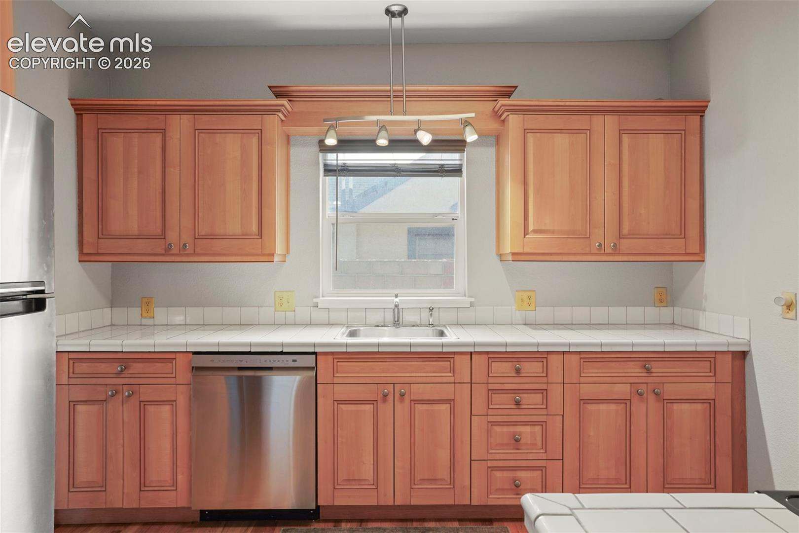 Adorable kitchen has plenty of counter space and storage!