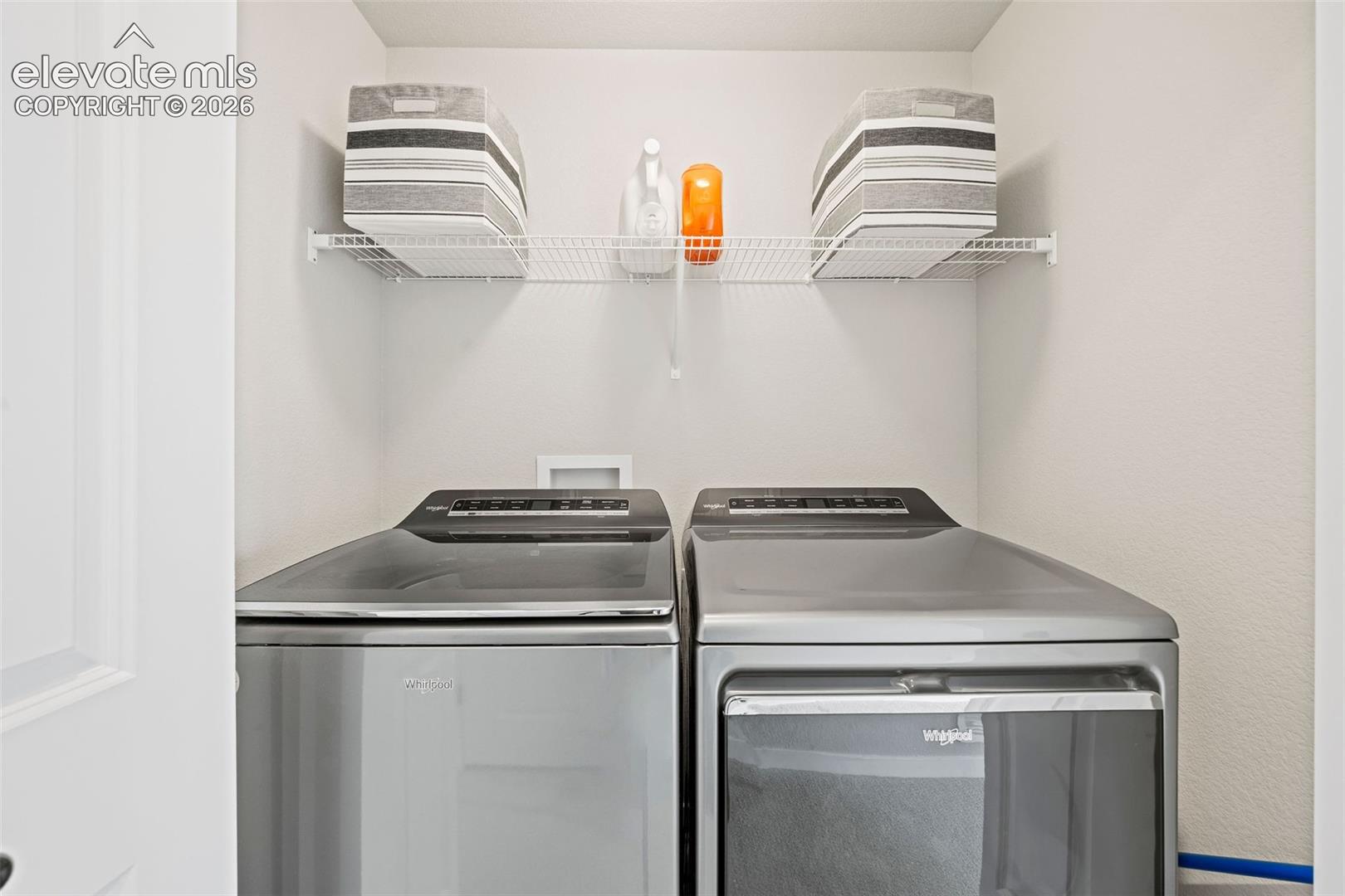 The laundry area is perfectly located in the upstairs hallway between the two upstairs bedrooms. 