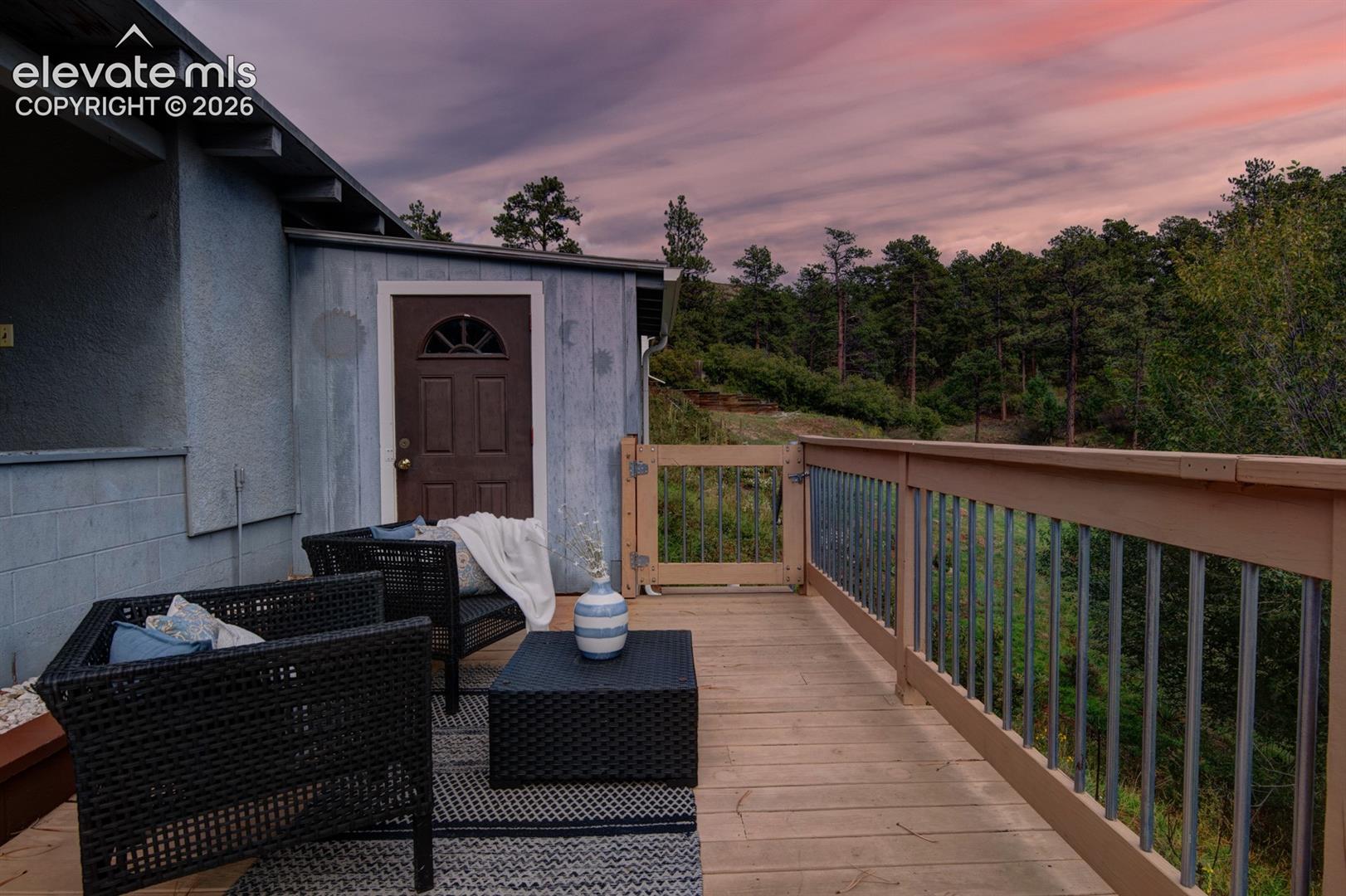 Relax in the inviting Deck seating area and experience the charm of Cascade, Colorado, surrounded by towering pines, cool mountain breezes, and a tranquil setting.