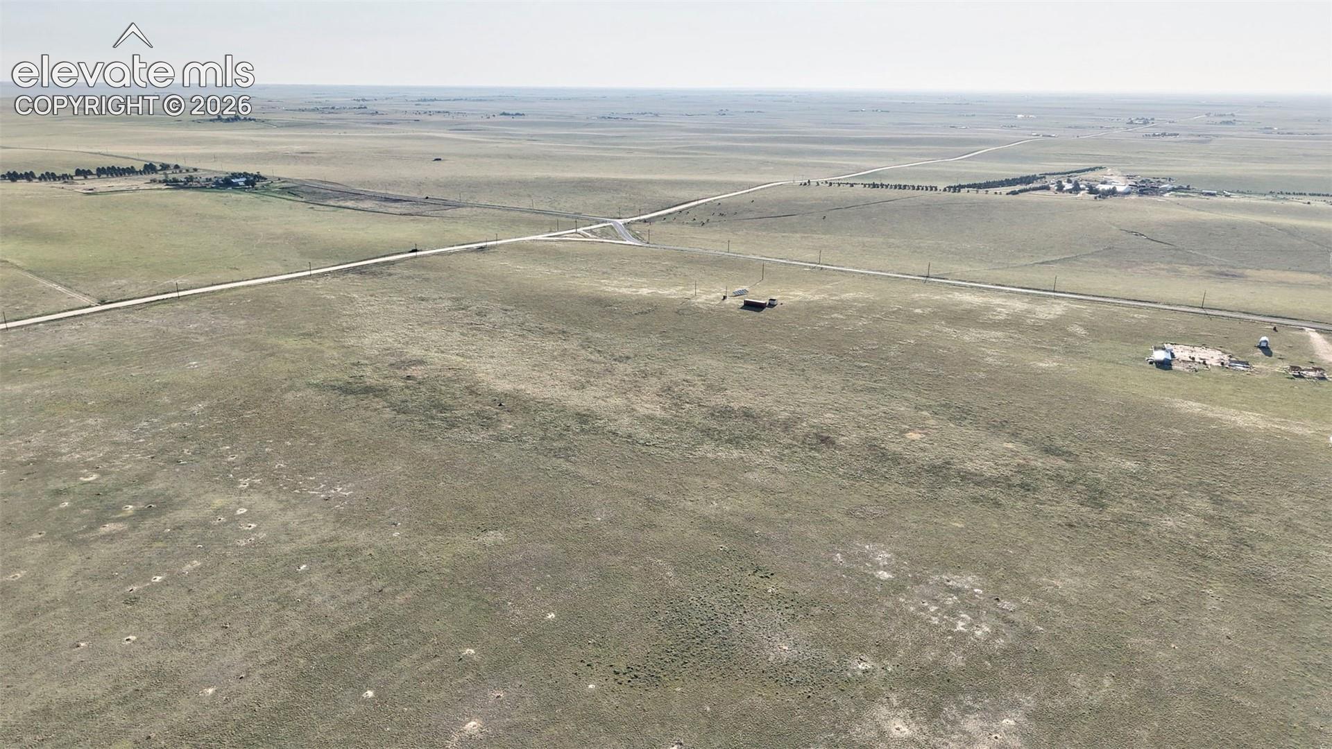 Expansive open land featuring a clear horizon and visible roadways