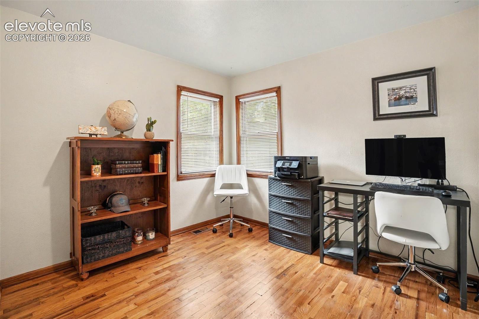 This bedroom is currently being used as an office, but has its own closet.
