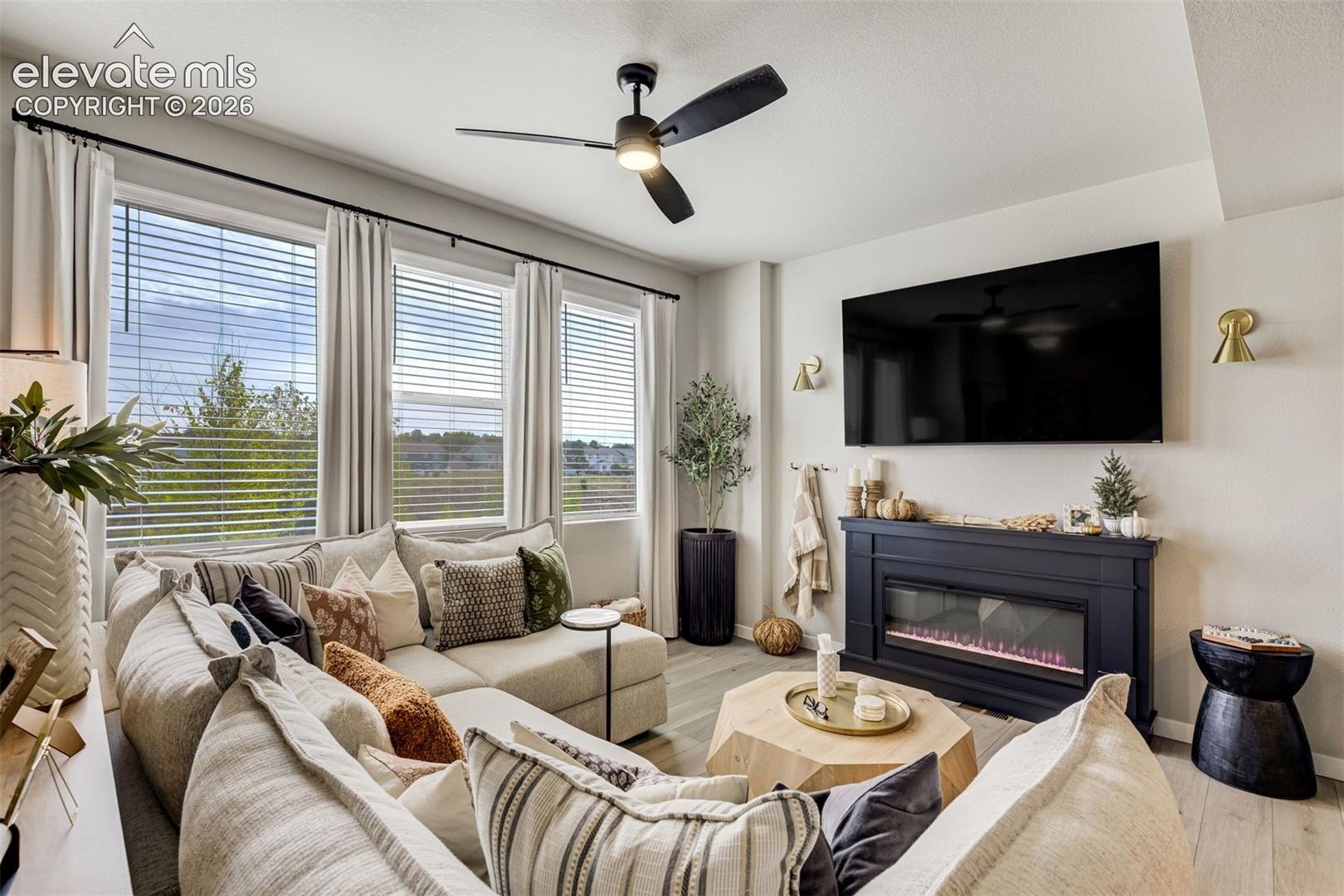 Electric fireplace with remote. Wall sconces are rechargeable.