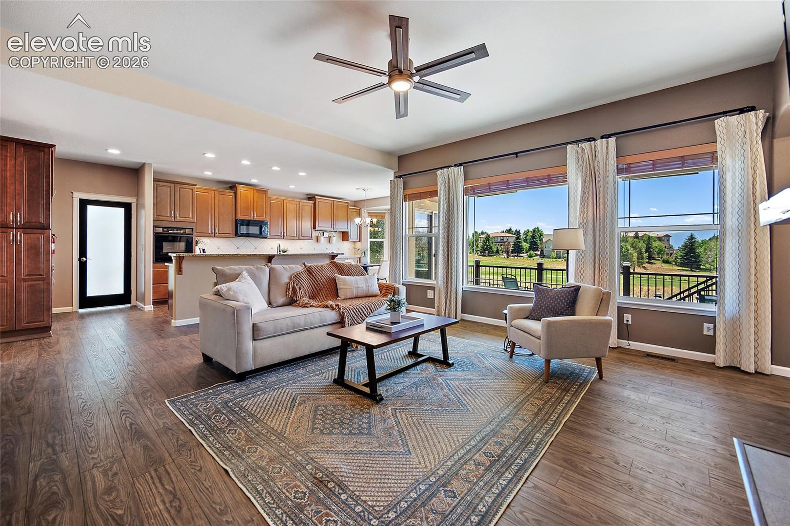 Living Room faces west & has golf and mountain views