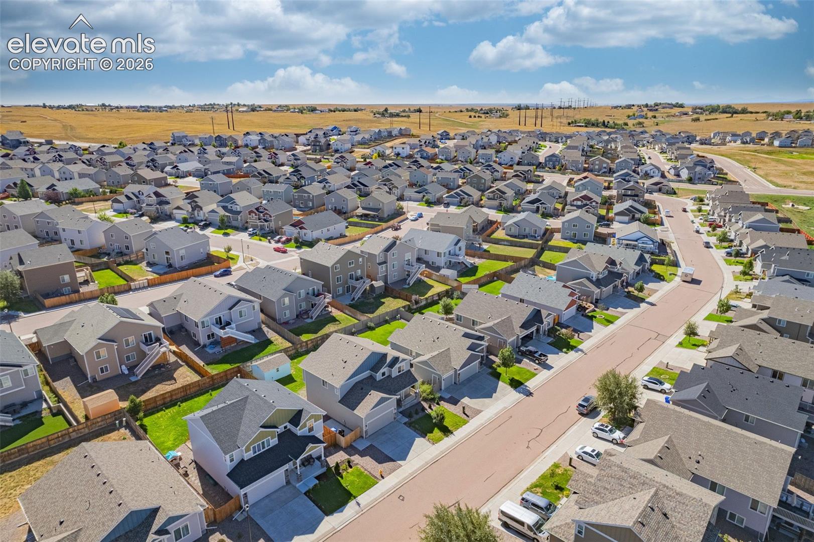 Residential neighborhood with uniform housing styles and street infrastructure