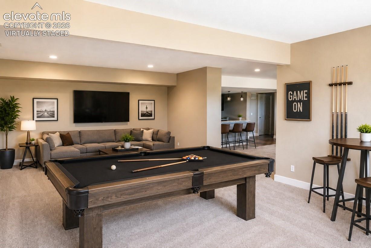 Virtually staged basement Recreational room featuring a wood-finish pool table, recessed lighting, and soft carpet flooring