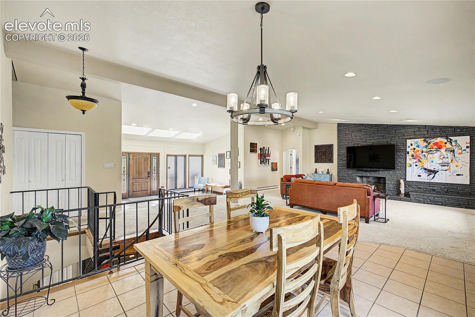 The vaulted ceilings and skylit great room reveal just how much natural light moves through the home's main level.