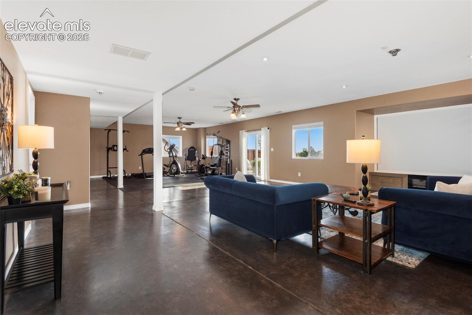 Large Theater Area with a Huge Theater Sized Screen, Ceiling Projector and a Wired Sound System and an Electric Fireplace to keep you Toasty Warm