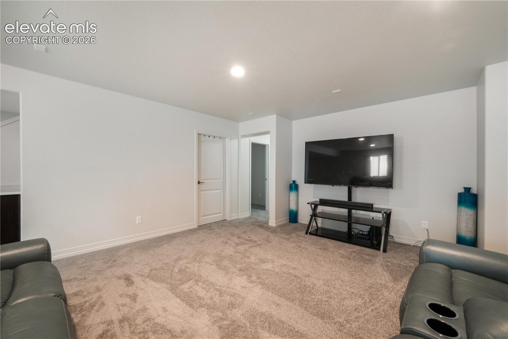 Basement family room with mini wet bar, new carpet