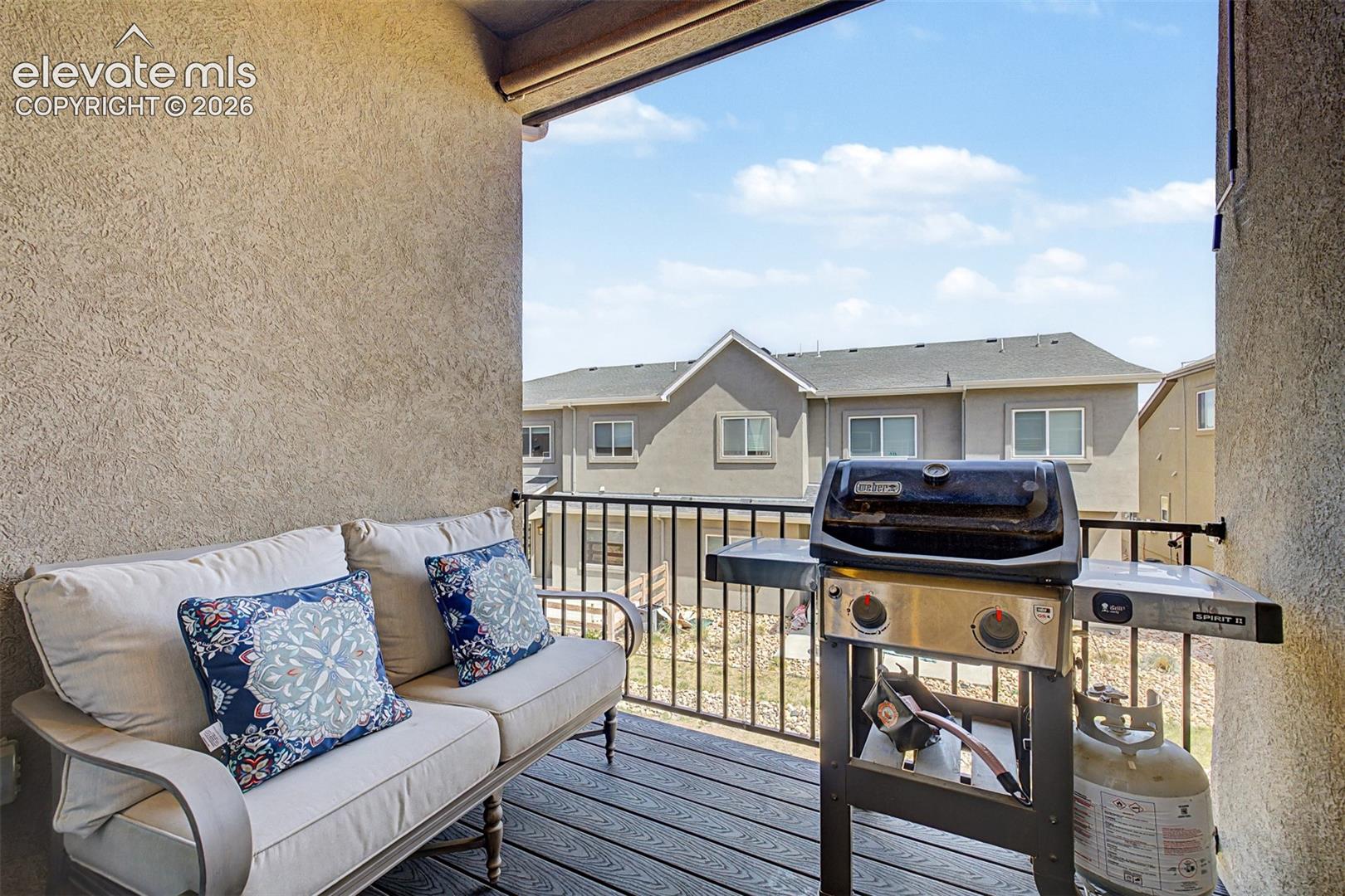 The back balcony is outfitted for real outdoor living make this covered space an easy extension of the kitchen for warm-weather evenings under the Colorado sky.