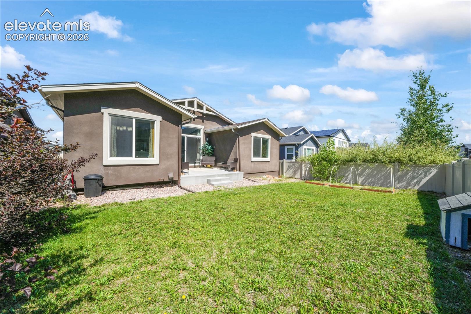 Back of home, patio and landscaping