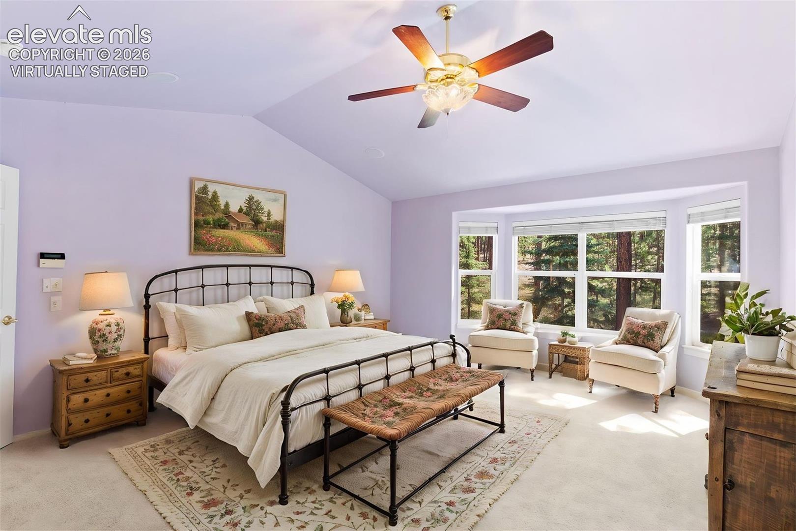 *virtually staged* Primary bedroom with vaulted ceiling, ceiling fan, ensuite bathroom, and walk in closet