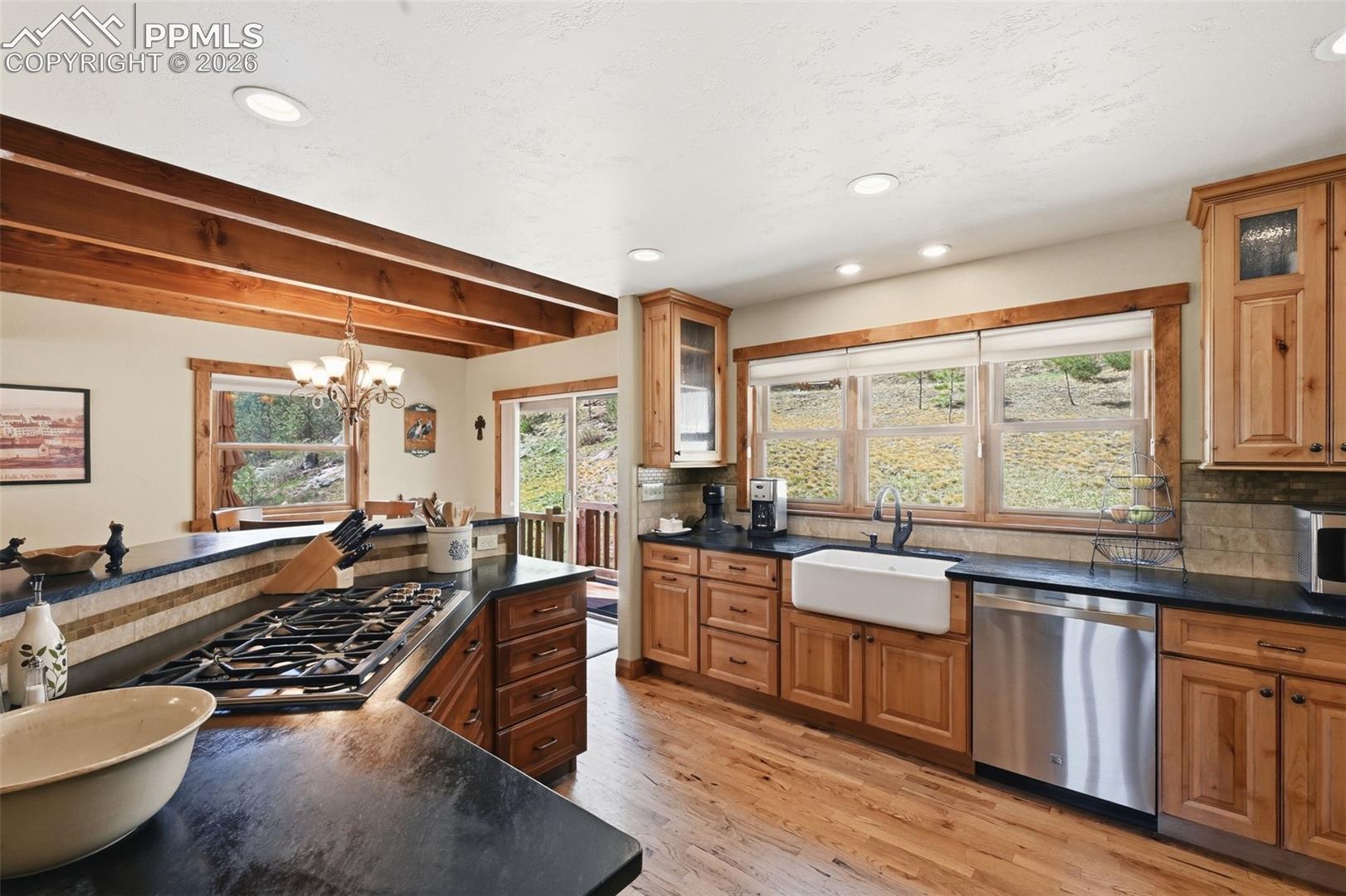 This spacious kitchen provides abundant storage and countertop space, while maintaining an elegant style and great functionality. 