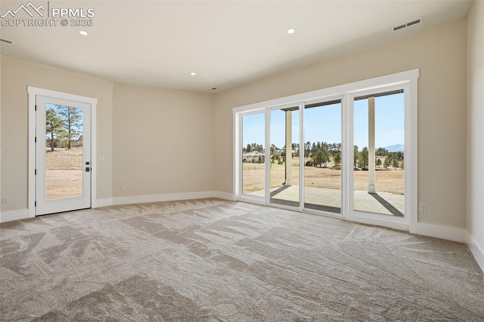 2nd Bedroom Suite with 3/4 bath, walk-in closet and walk-out patio.